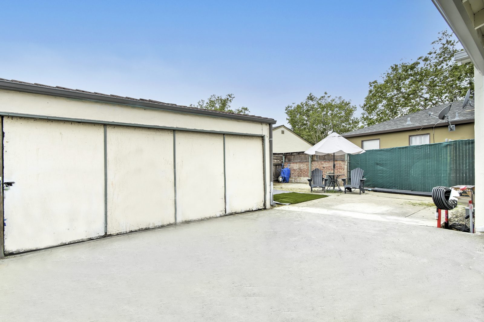 Shared backyard garden and grilling area